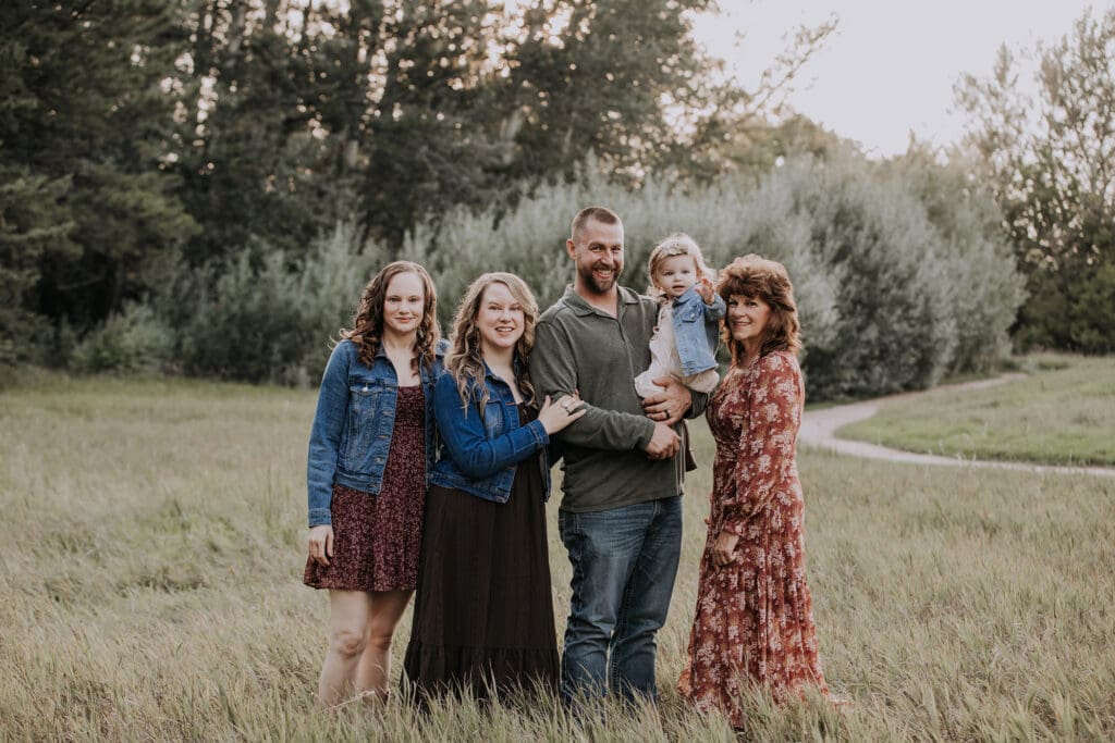 Rapid City, South Dakota family photography, family in wooded area with open field