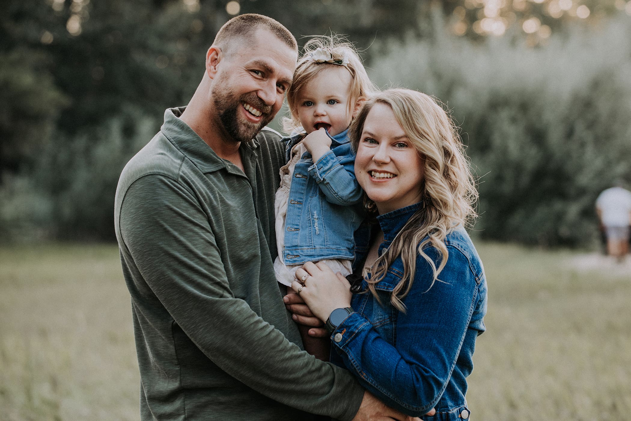 Rapid City, South Dakota family photography, mom and dad with baby in a wooded area
